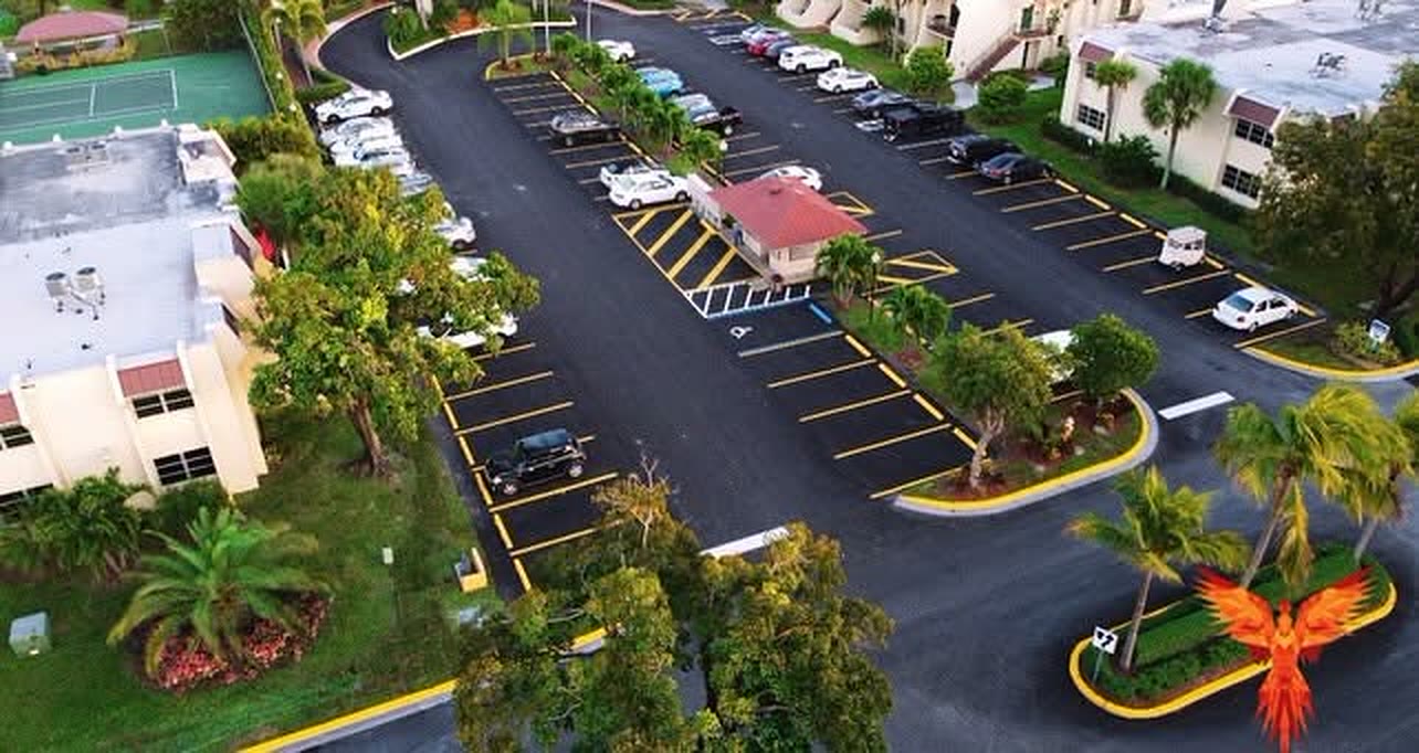 Dusk drone view of the Residences at The Falls parking areas after a full repave by Phoenix Concrete Plus